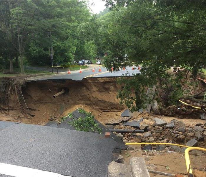 Damage to a road from flooding near Barberton/Norton 