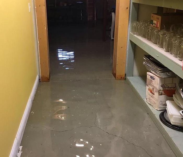 A hallway with standing water from flooding in Barberton, Ohio