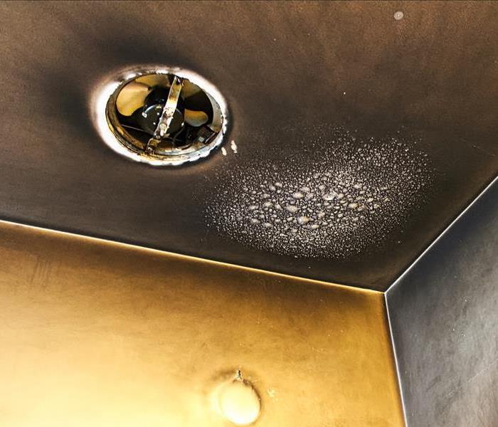 Smoke damage on the ceiling of a house