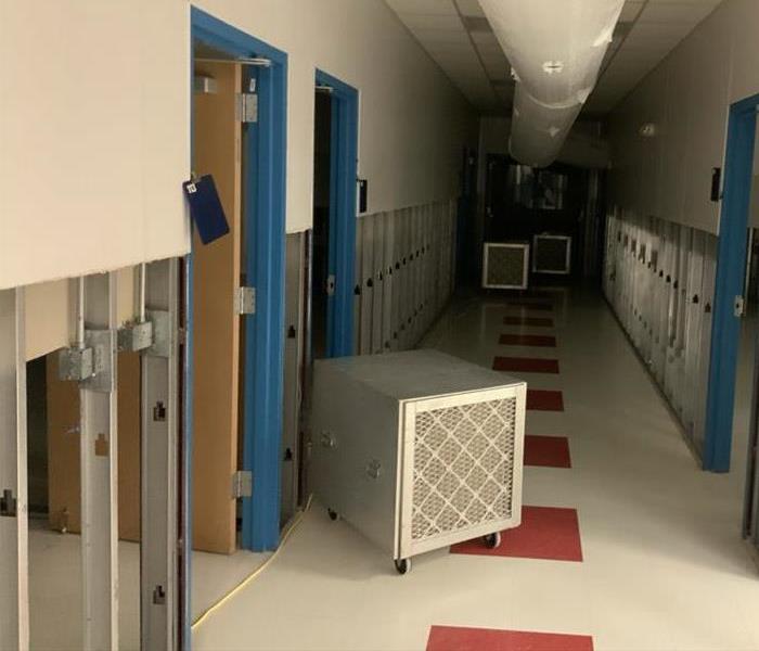 Walls cut in long hallway