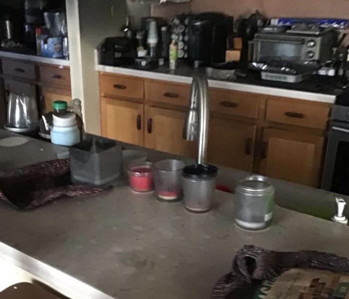 Kitchen covered in soot and smoke